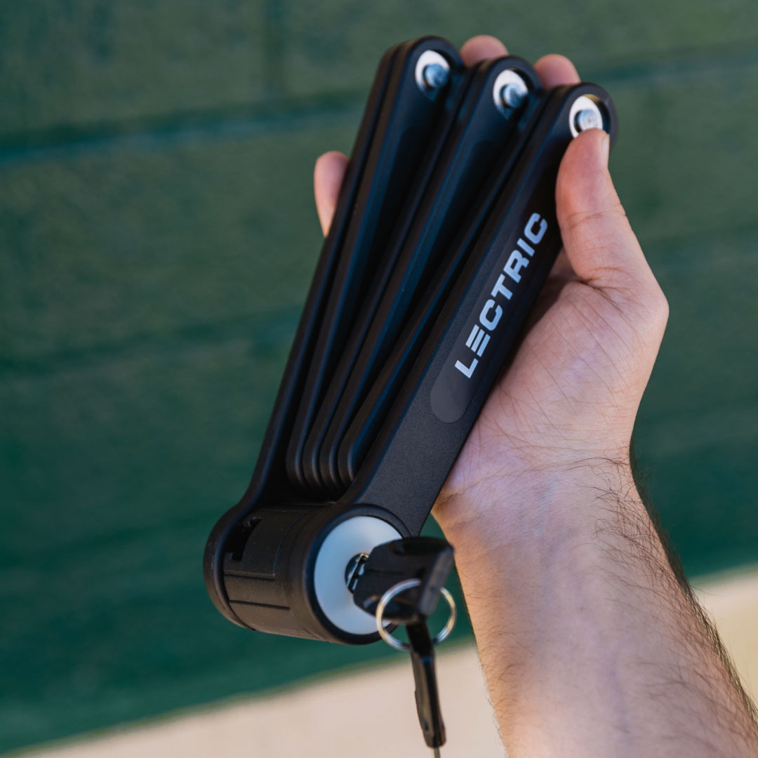 Person holding Lectric eBikes Folding Bike Lock