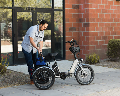 maintenance man loading tools in the cargo package of the XP Trike