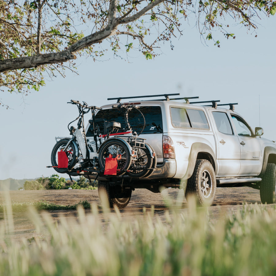 Lectric XP Trike and Lectric Xpedition on a bike rake attached to an SUV