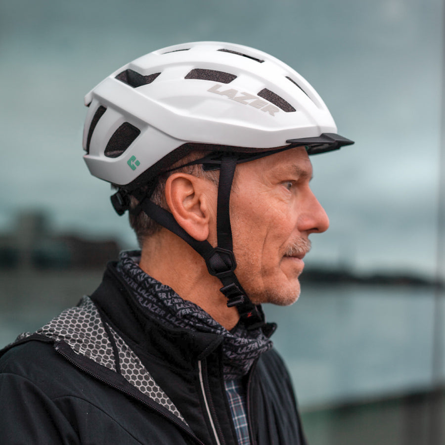 elderly man with white lazer helmet looking left