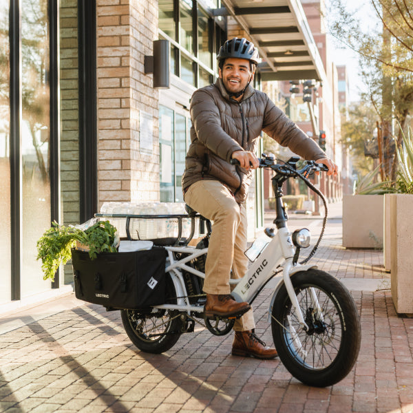 iding lectric ebike in city with  groceries